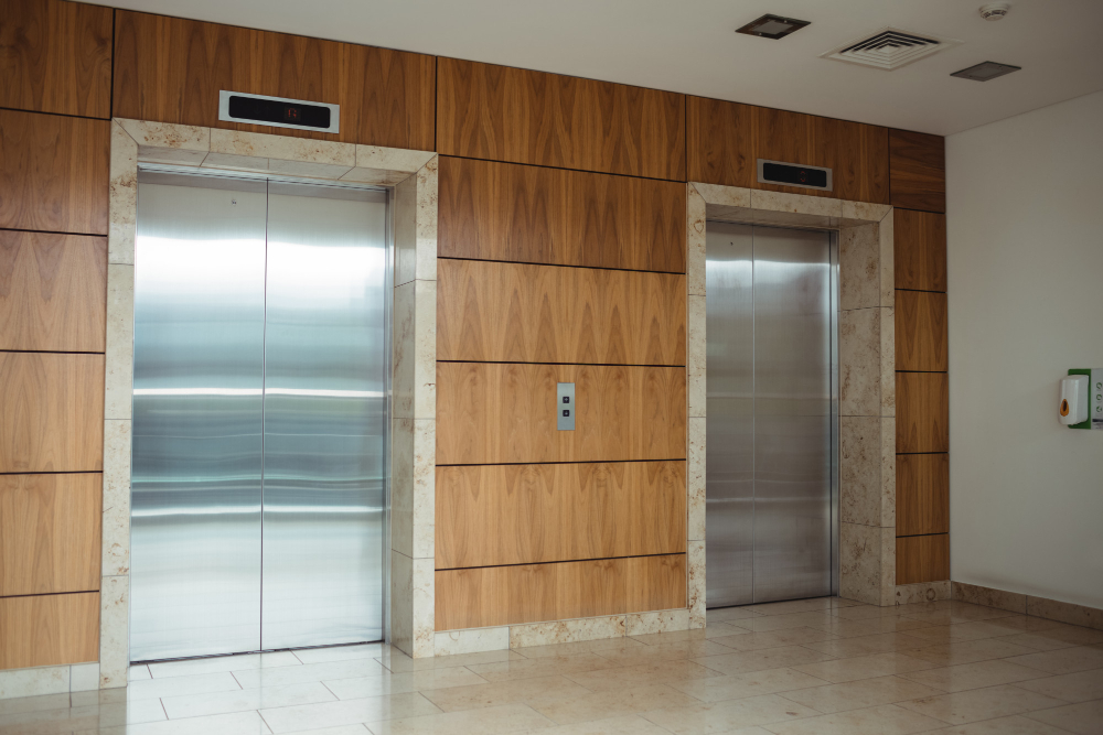 Modern elevator doors in a residential building lobby