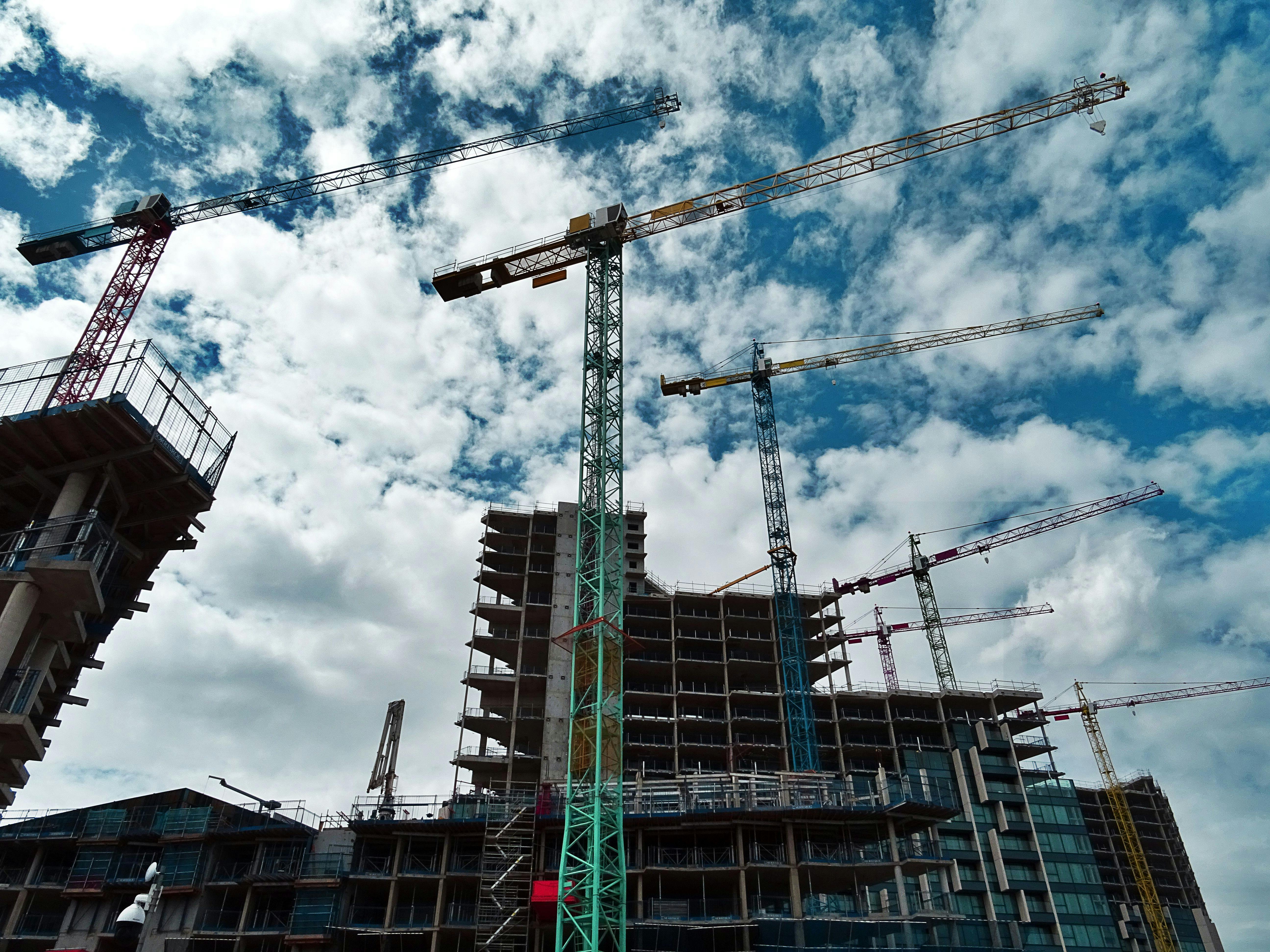 Building under construction with scaffolding and structural columns